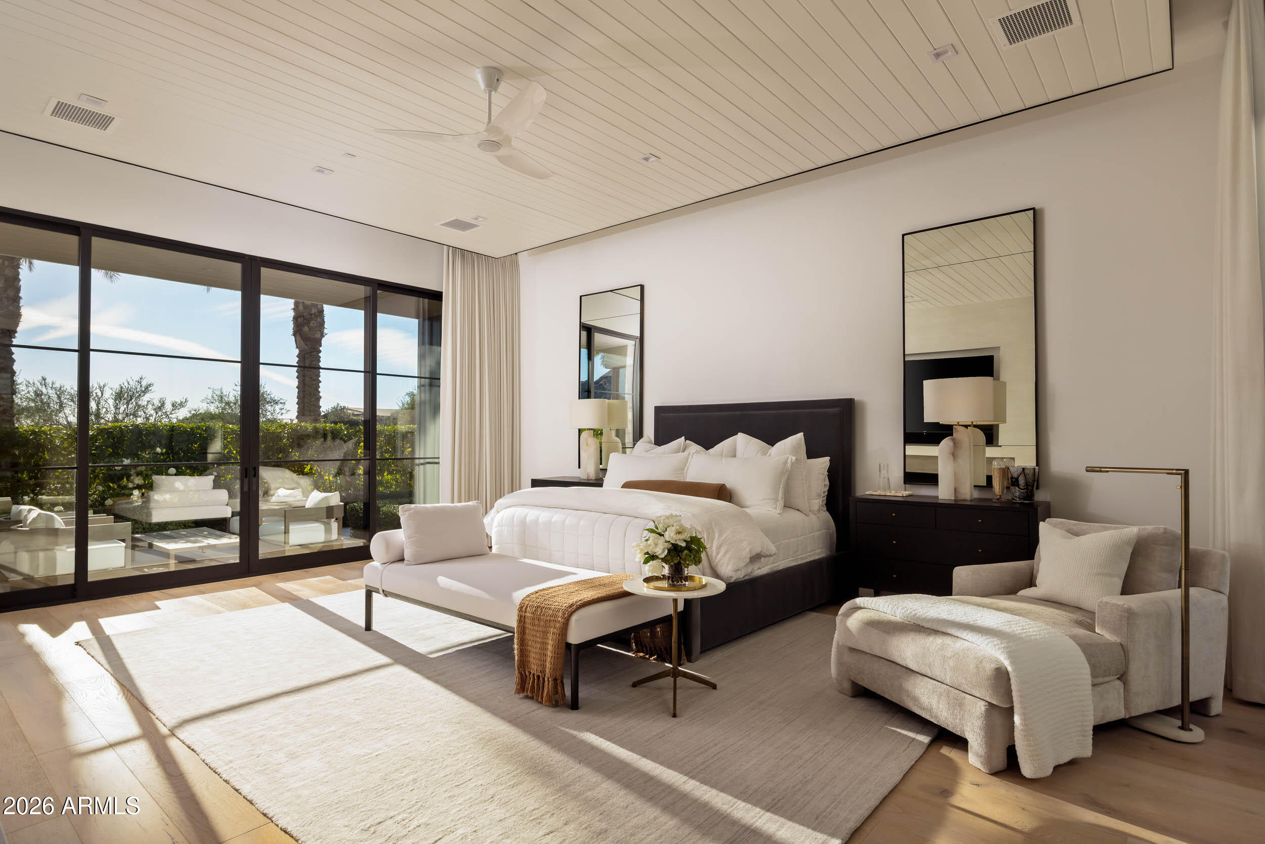 6800 North Mummy Mountain Road Paradise Valley, AZ 85253 - Photo 21 of 61 a bedroom with double bed and a large window