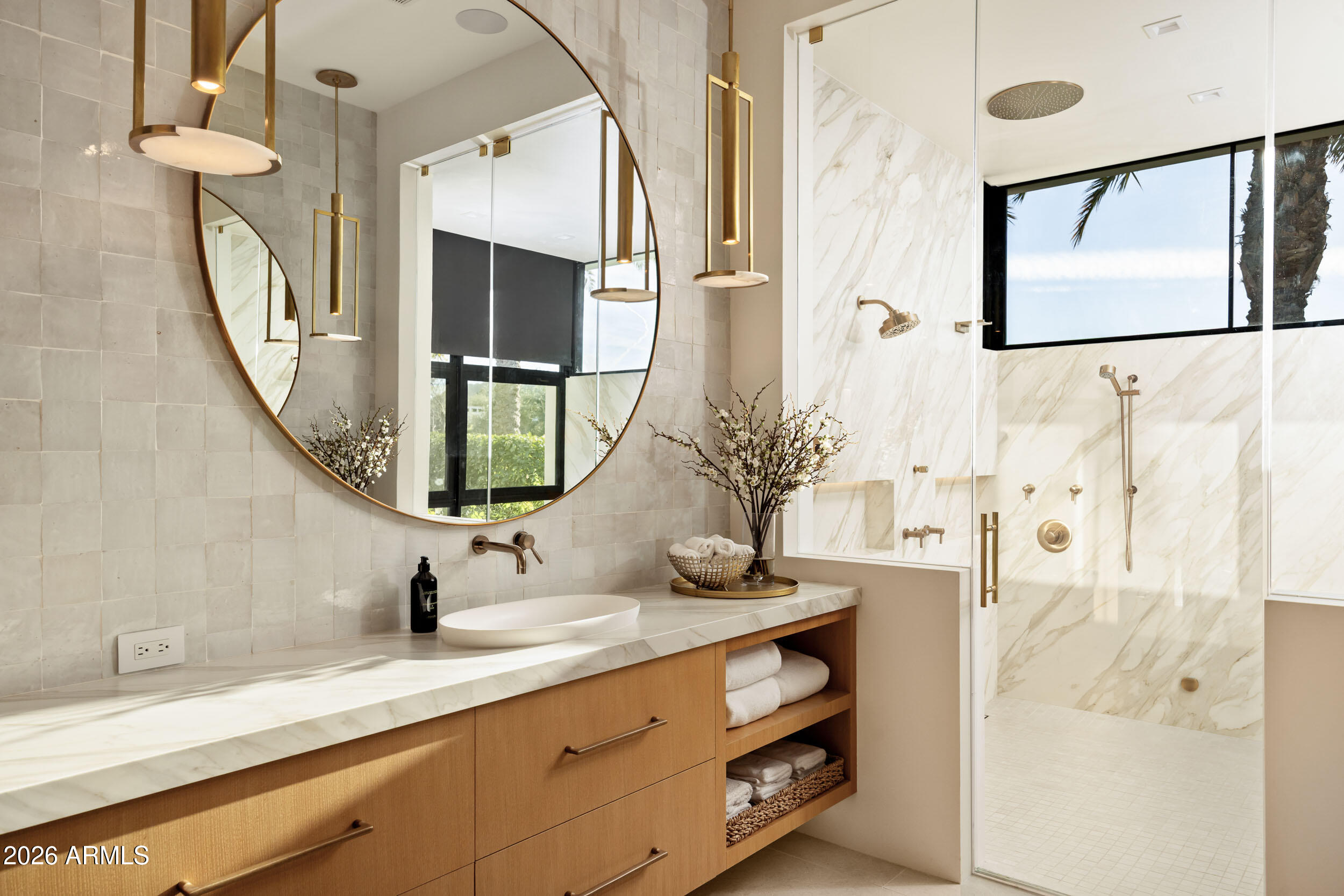 6800 North Mummy Mountain Road Paradise Valley, AZ 85253 - Photo 25 of 61 a bathroom with a sink and a mirror