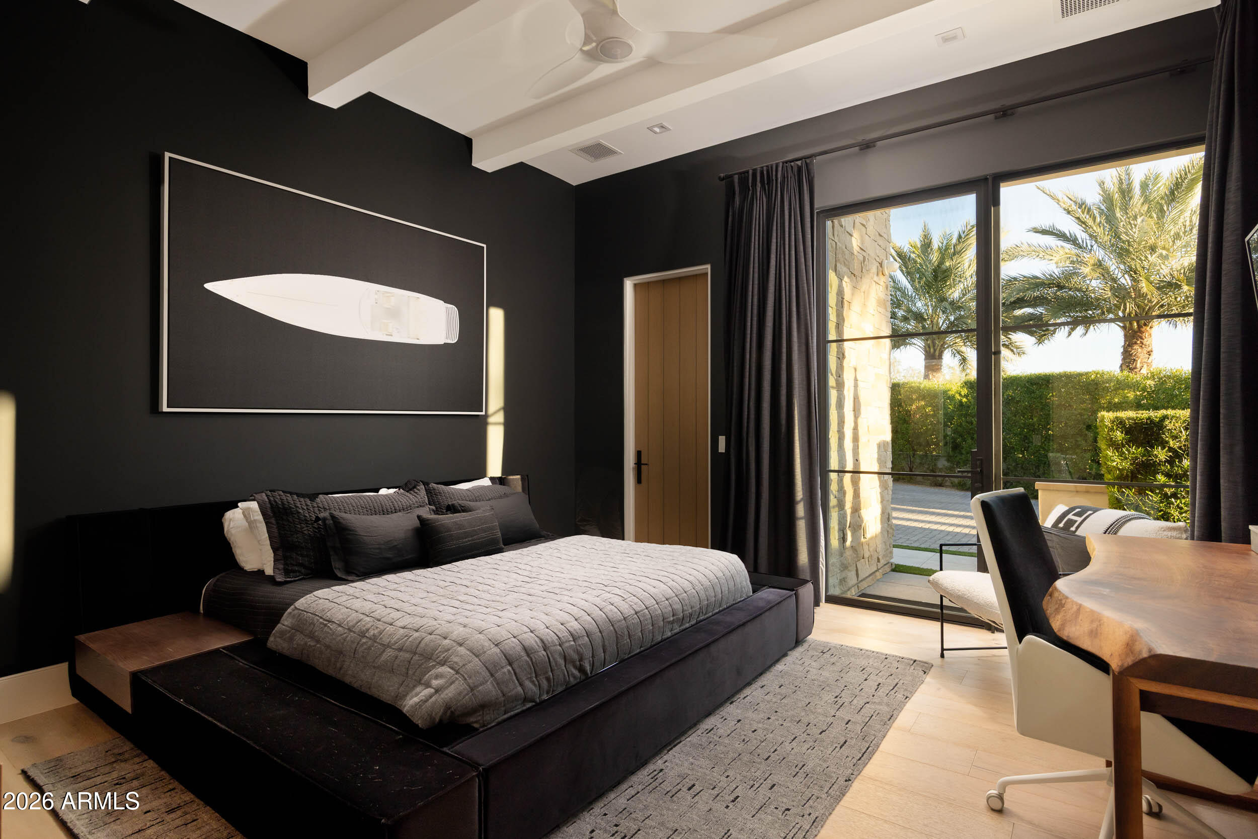 6800 North Mummy Mountain Road Paradise Valley, AZ 85253 - Photo 27 of 61 a bedroom with a bed and a large window