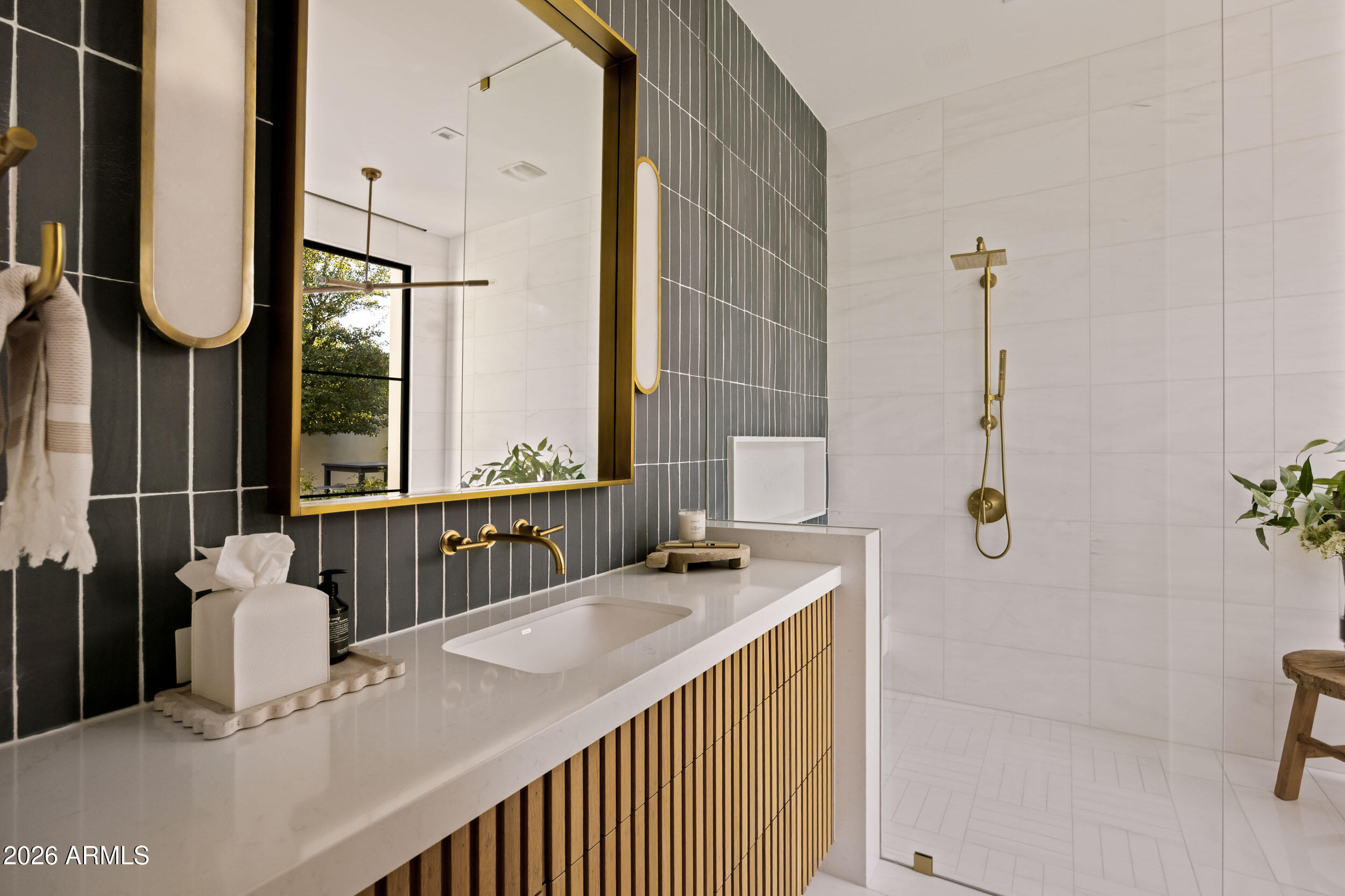 6800 North Mummy Mountain Road Paradise Valley, AZ 85253 - Photo 36 of 61 a bathroom with a granite countertop sink and a mirror