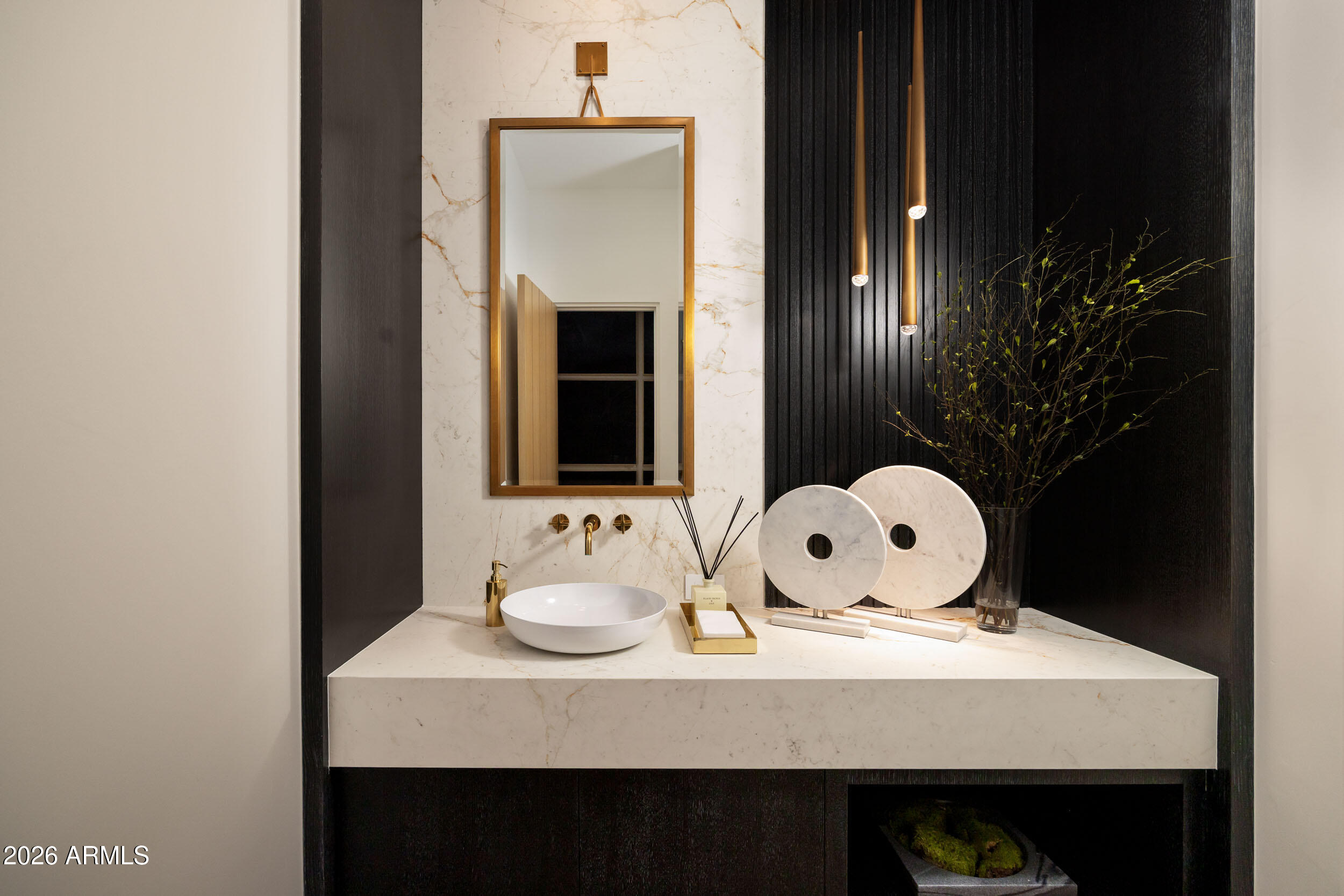 6800 North Mummy Mountain Road Paradise Valley, AZ 85253 - Photo 37 of 61 a bathroom with a sink a mirror and window