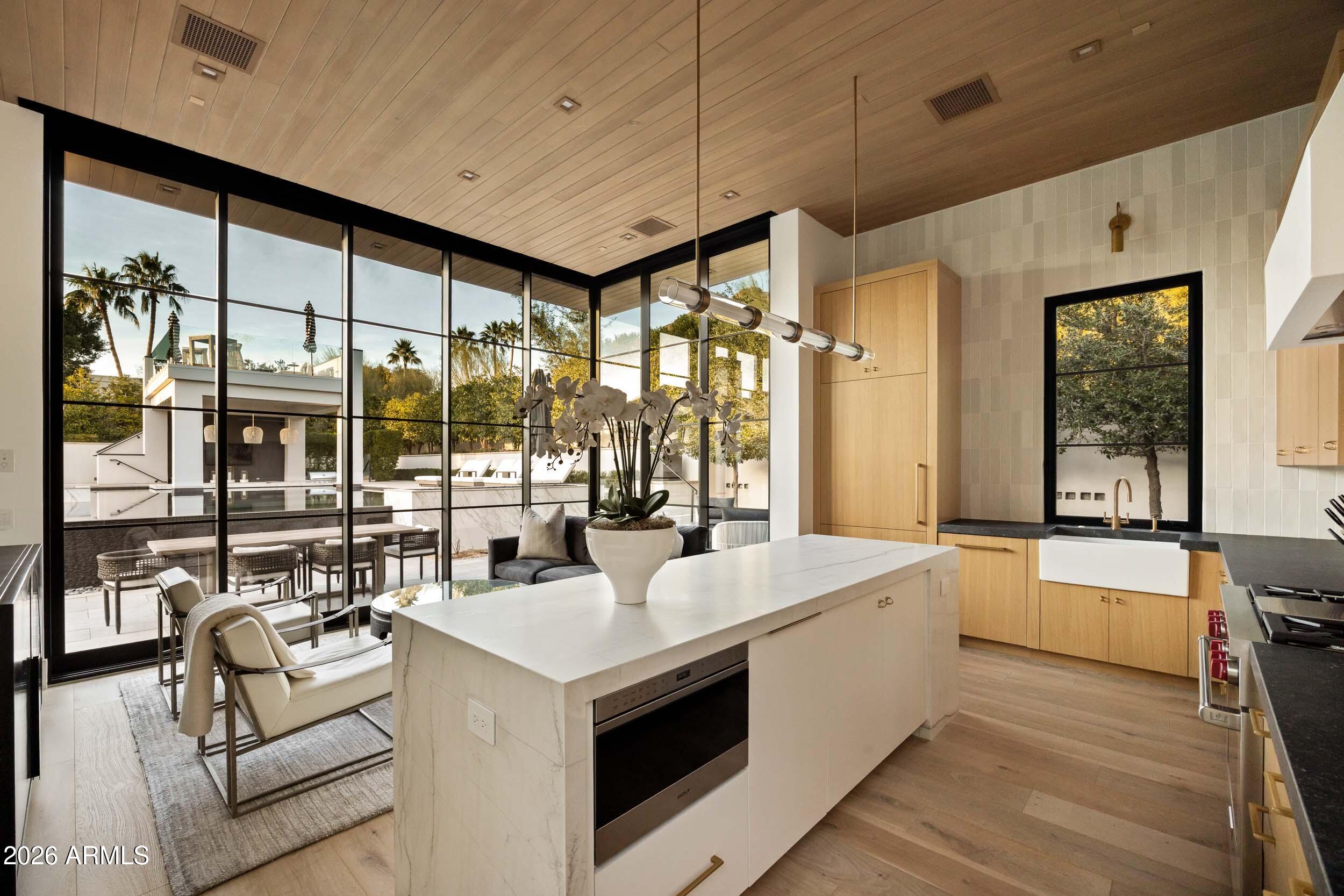 6800 North Mummy Mountain Road Paradise Valley, AZ 85253 - Photo 39 of 61 a large white kitchen with a large window
