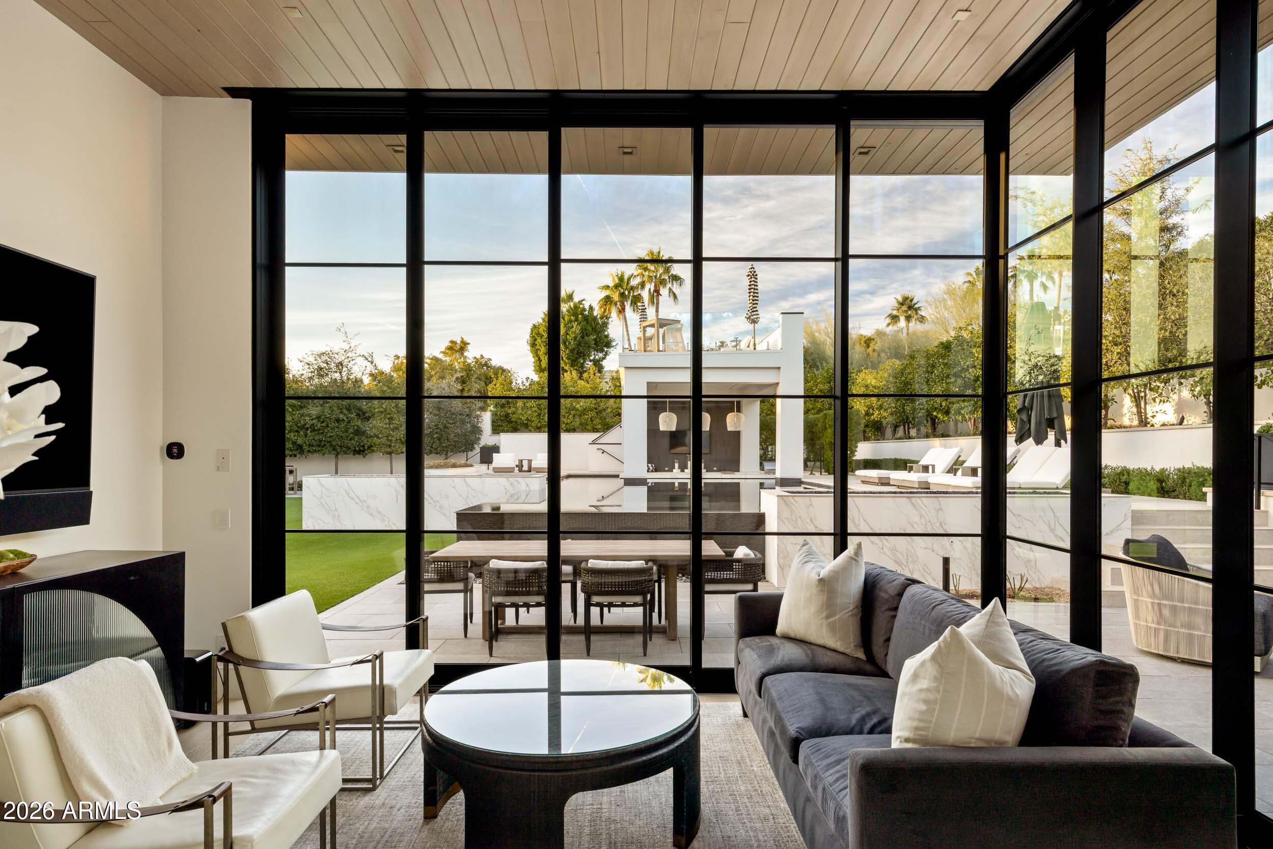 6800 North Mummy Mountain Road Paradise Valley, AZ 85253 - Photo 40 of 61 a living room with furniture and a large window