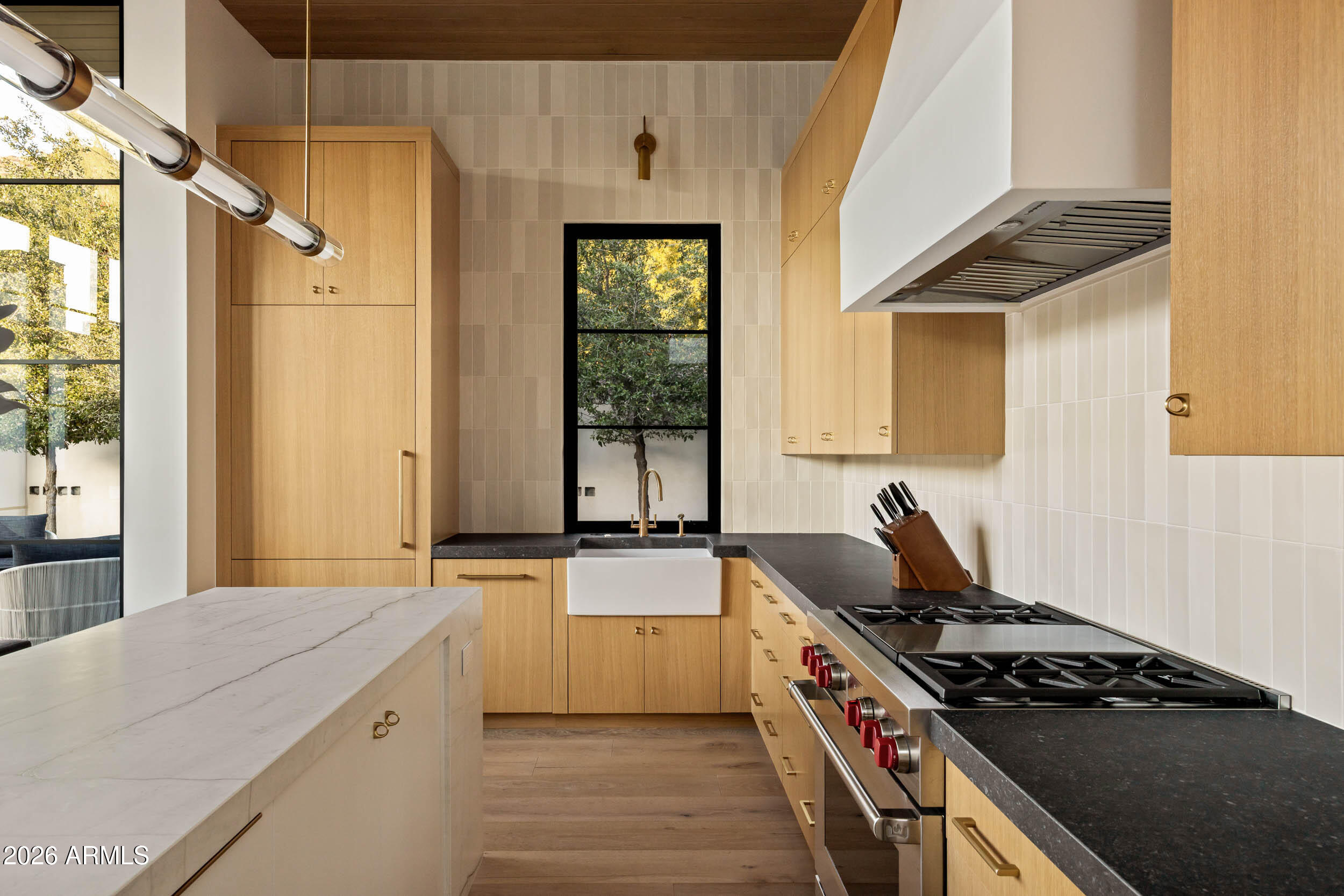 6800 North Mummy Mountain Road Paradise Valley, AZ 85253 - Photo 42 of 61 a kitchen with a stove a sink and a refrigerator