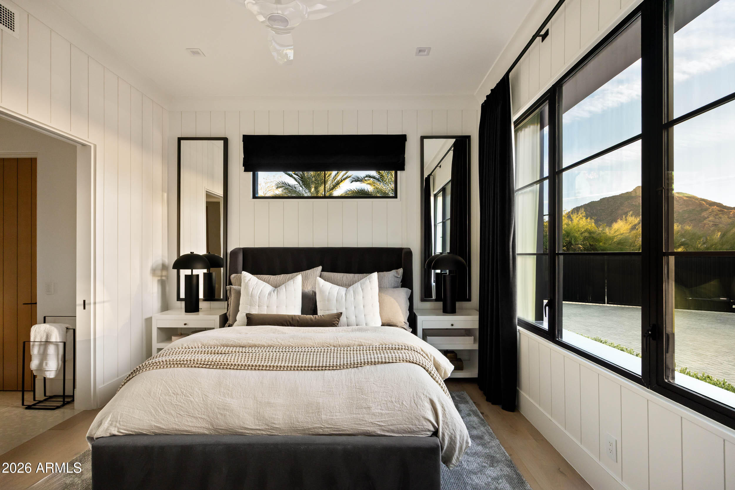 6800 North Mummy Mountain Road Paradise Valley, AZ 85253 - Photo 43 of 61 a bedroom with a large bed and a large window