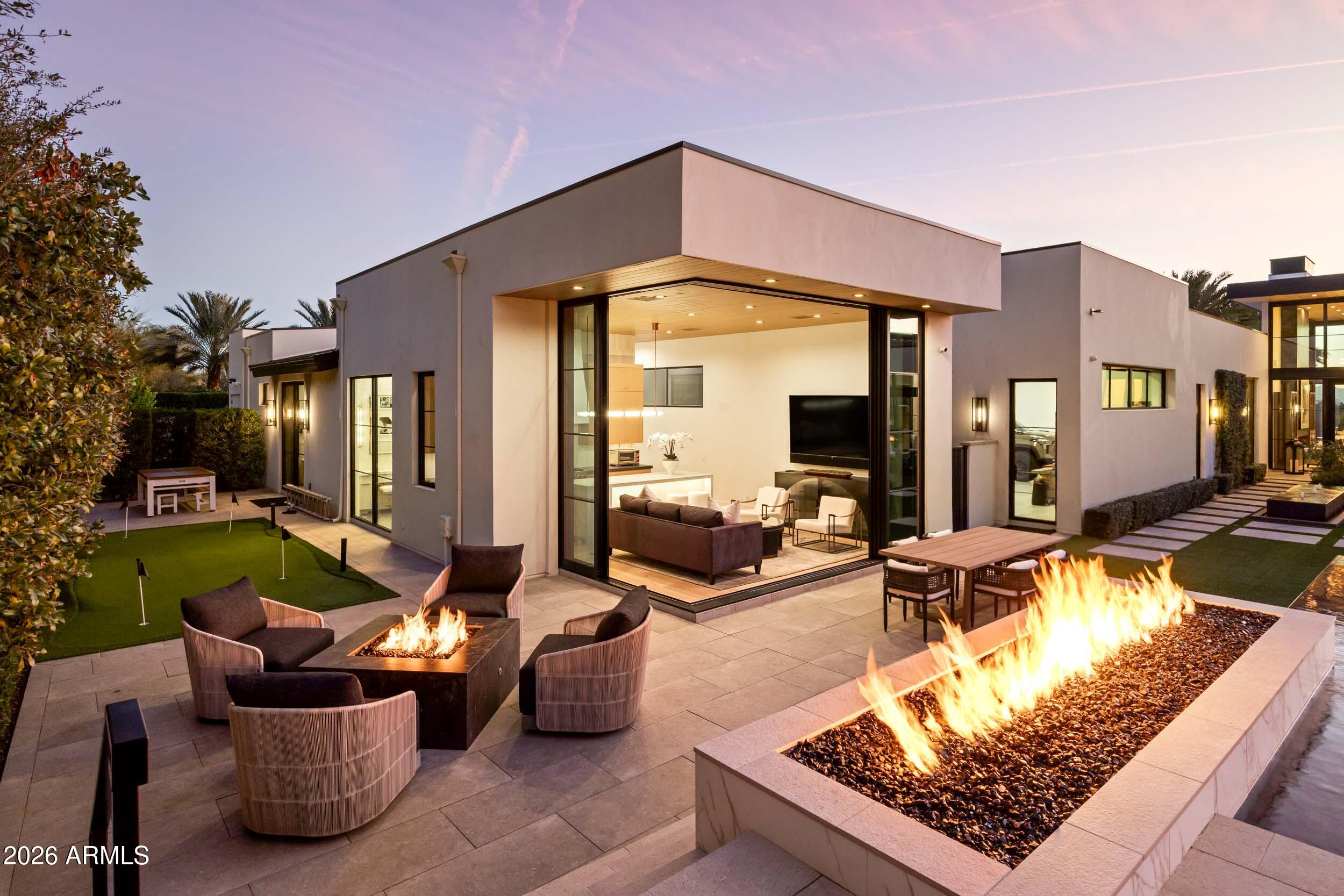 6800 North Mummy Mountain Road Paradise Valley, AZ 85253 - Photo 50 of 61 a view of swimming pool with outdoor seating
