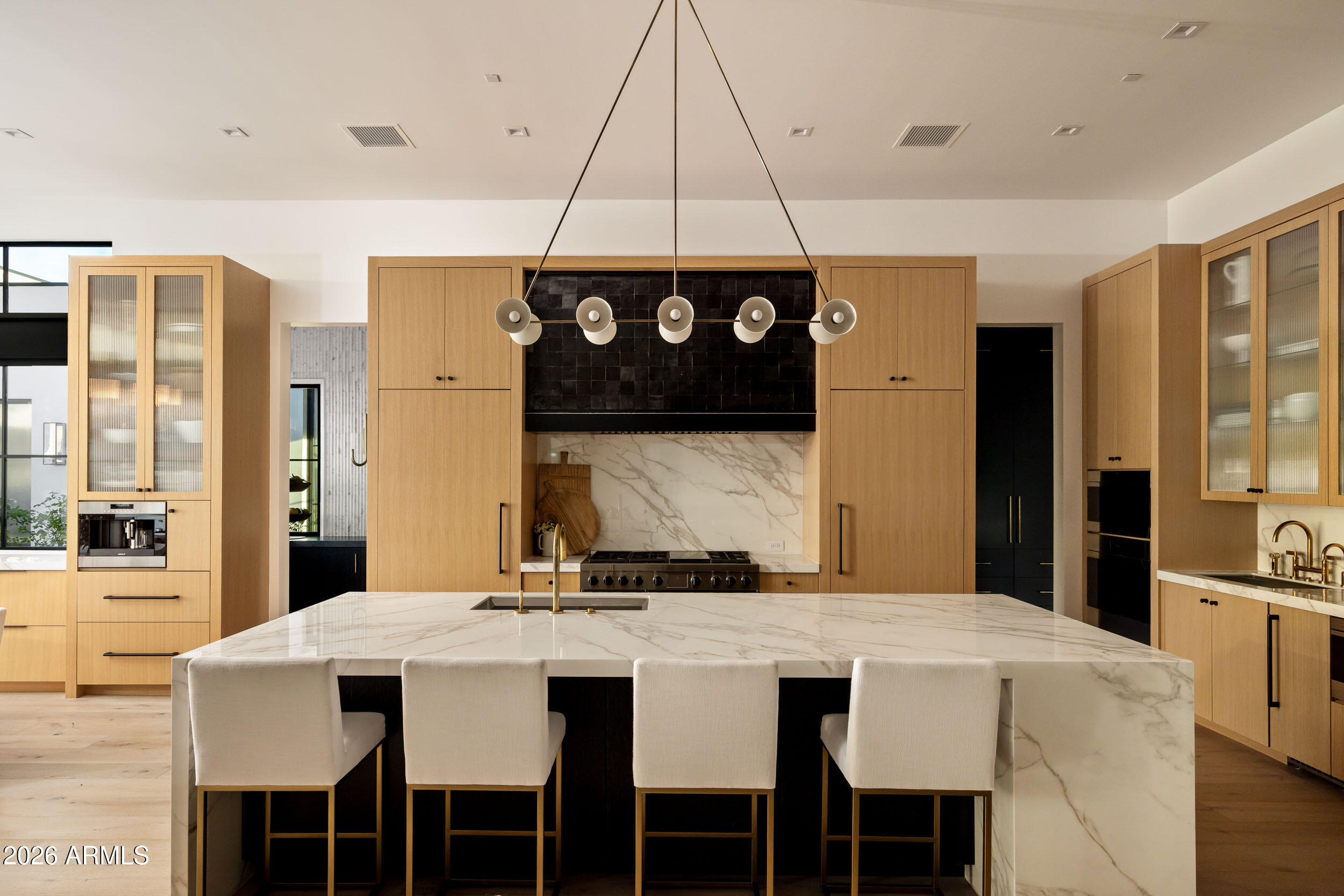 6800 North Mummy Mountain Road Paradise Valley, AZ 85253 - Photo 5 of 61 a large kitchen with a table and chairs