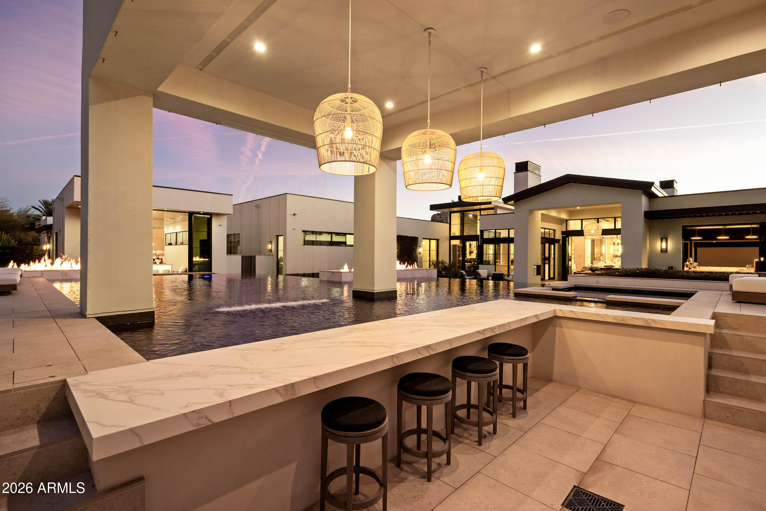 6800 North Mummy Mountain Road Paradise Valley, AZ 85253 - Photo 52 of 61 a large kitchen with granite countertop a sink and a stove