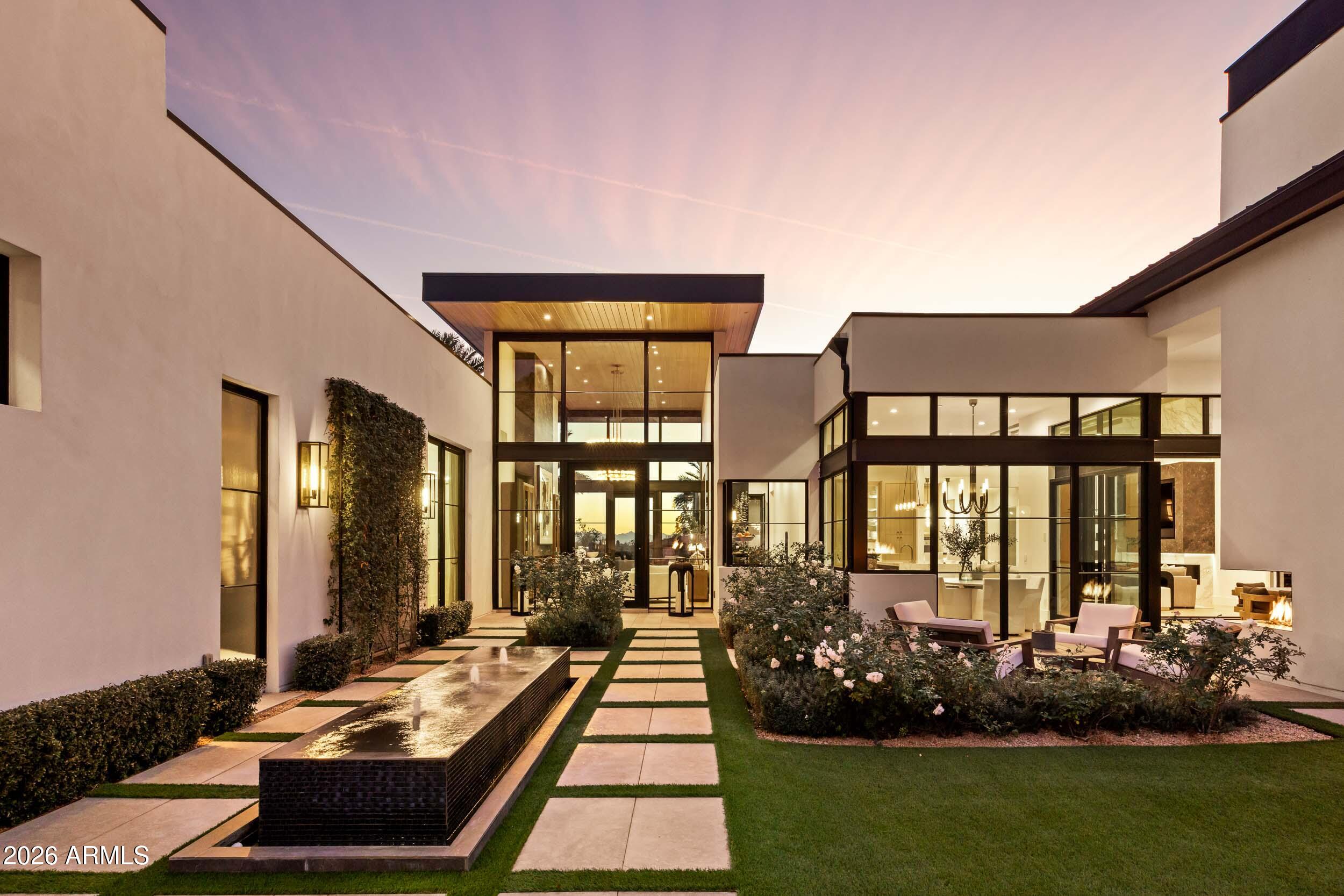 6800 North Mummy Mountain Road Paradise Valley, AZ 85253 - Photo 55 of 61 a front view of house with yard outdoor seating and green space