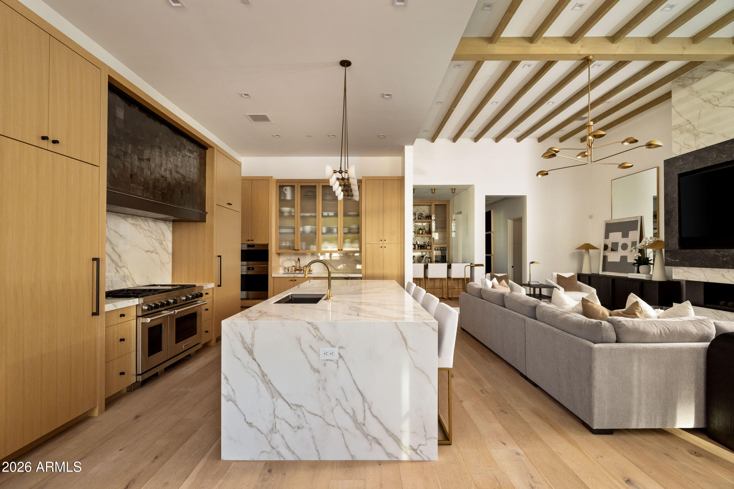 6800 North Mummy Mountain Road Paradise Valley, AZ 85253 - Photo 8 of 61 a living room with stainless steel appliances furniture and a flat screen tv