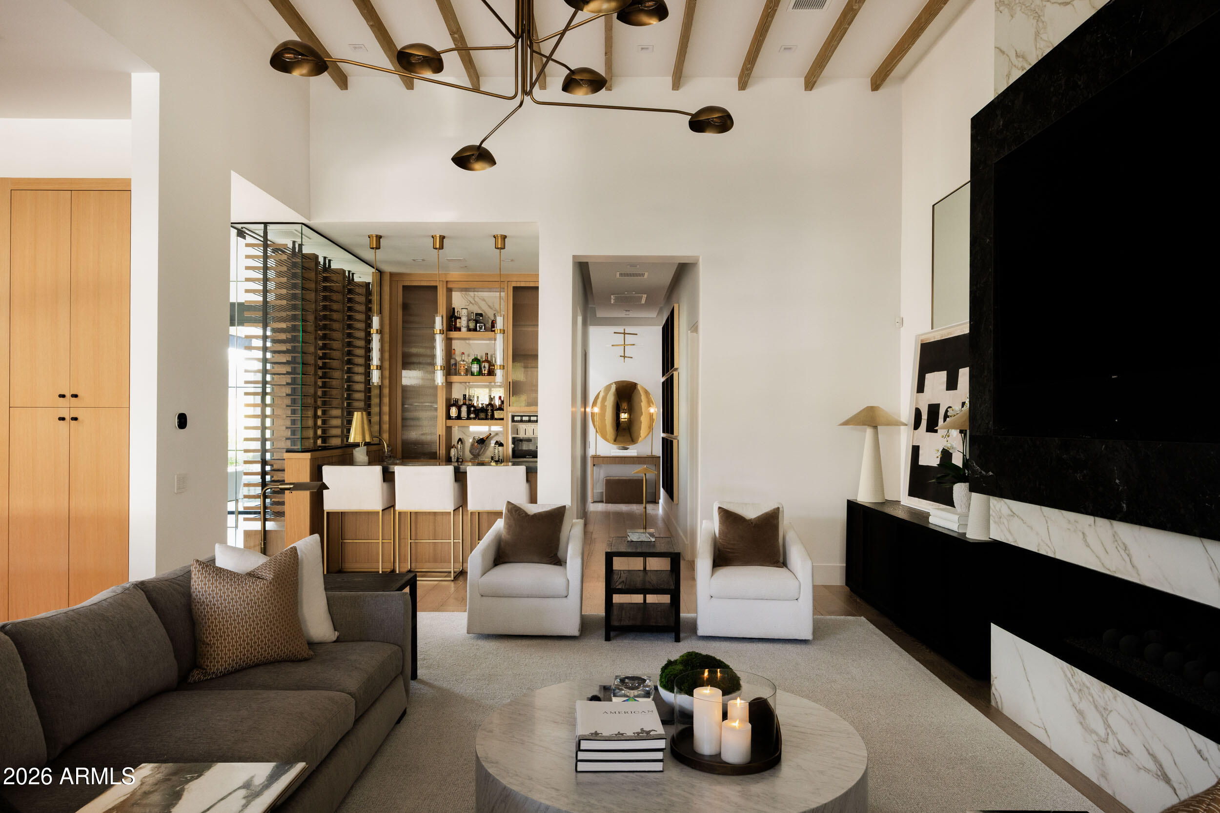 6800 North Mummy Mountain Road Paradise Valley, AZ 85253 - Photo 10 of 61 a living room with furniture and a flat screen tv
