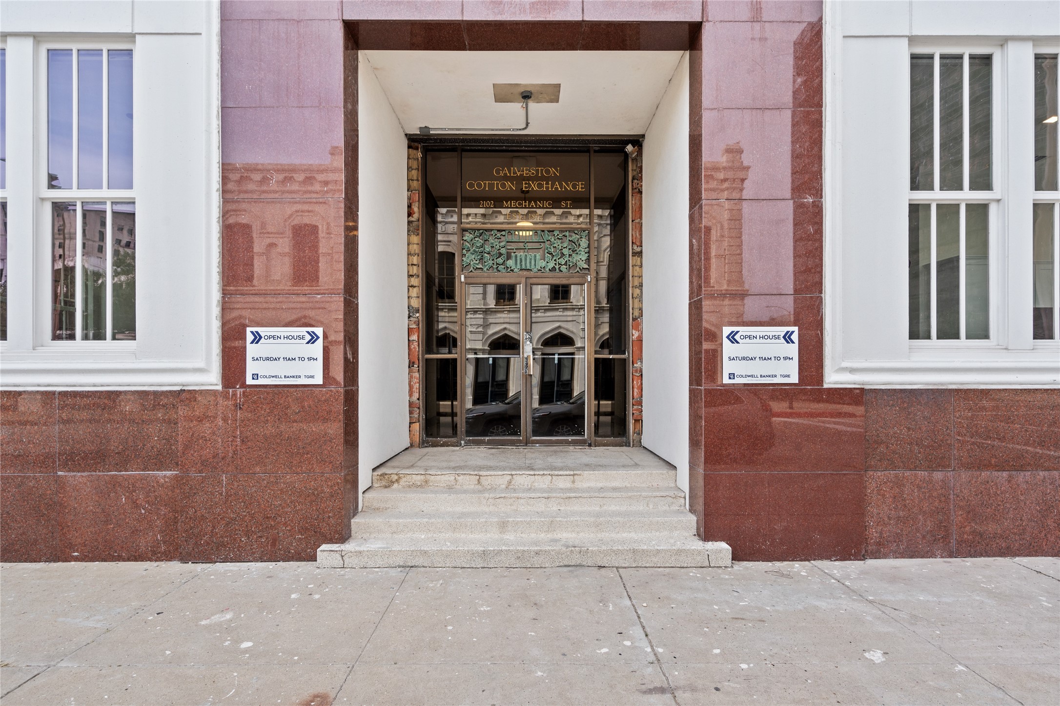 2102 Mechanic Street, Unit 202 Galveston, TX 77550 - Photo 21 of 22 a front view of a house with a yard