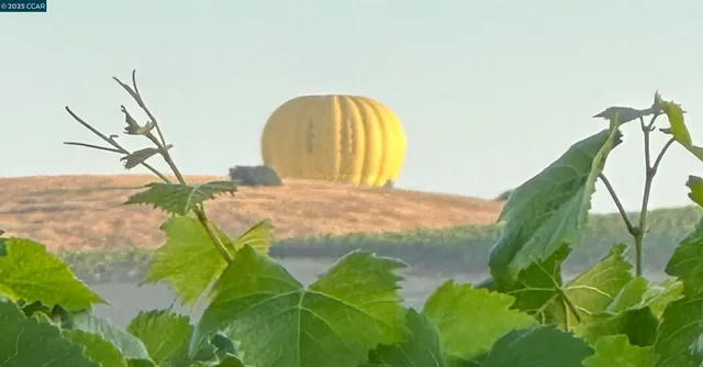 a view of a livingroom with furniture and stairs