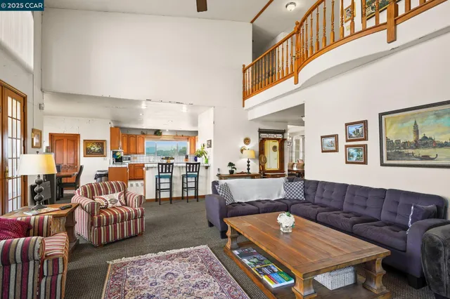 a kitchen with stainless steel appliances kitchen island granite countertop a sink and cabinets