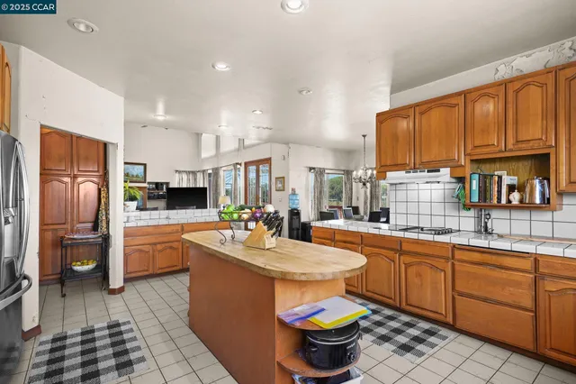 a bedroom with furniture and large windows