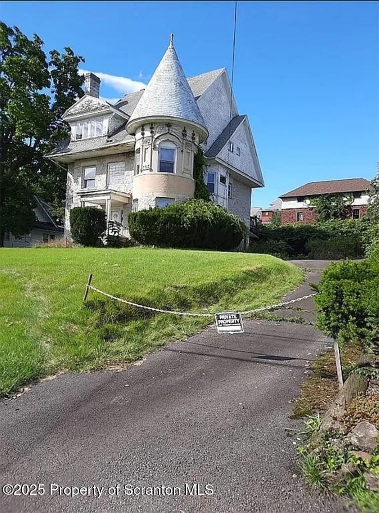 1021 Richmont Street Scranton, PA 18509 - Photo 3 of 42 a front view of a house with a yard and garage