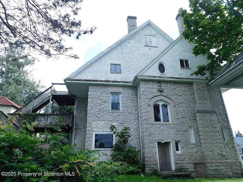 1021 Richmont Street Scranton, PA 18509 - Photo 5 of 42 a front view of a house with a garden