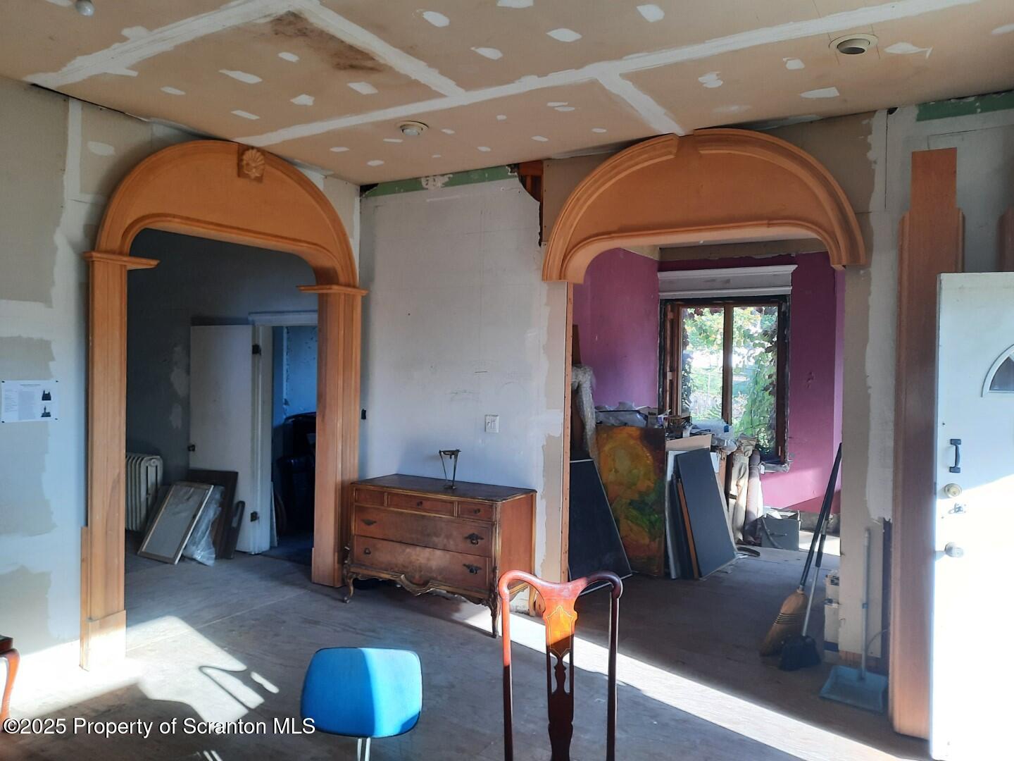 1021 Richmont Street Scranton, PA 18509 - Photo 9 of 42 a living room with furniture and a mirror