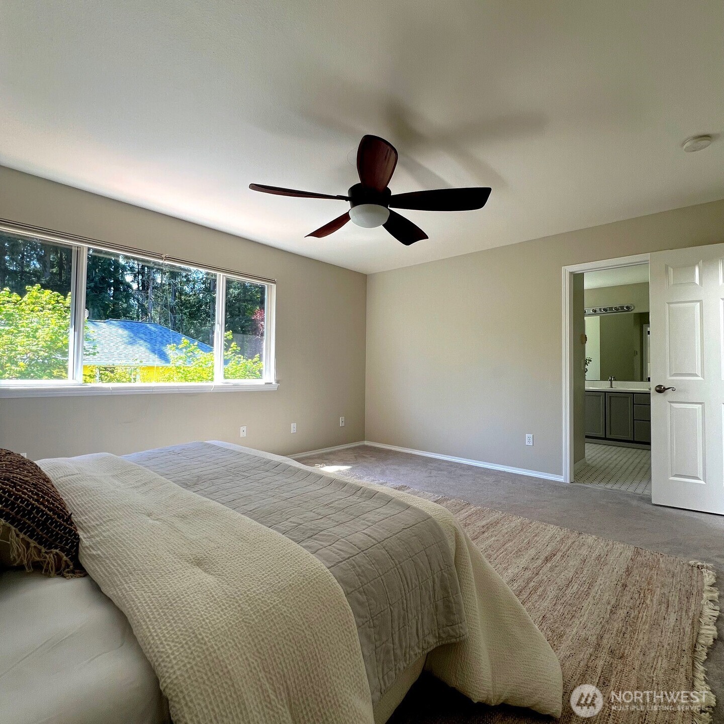 132 170th Place Southeast Bothell, WA 98012 - Photo 15 of 27 a bedroom with a bed and a large window