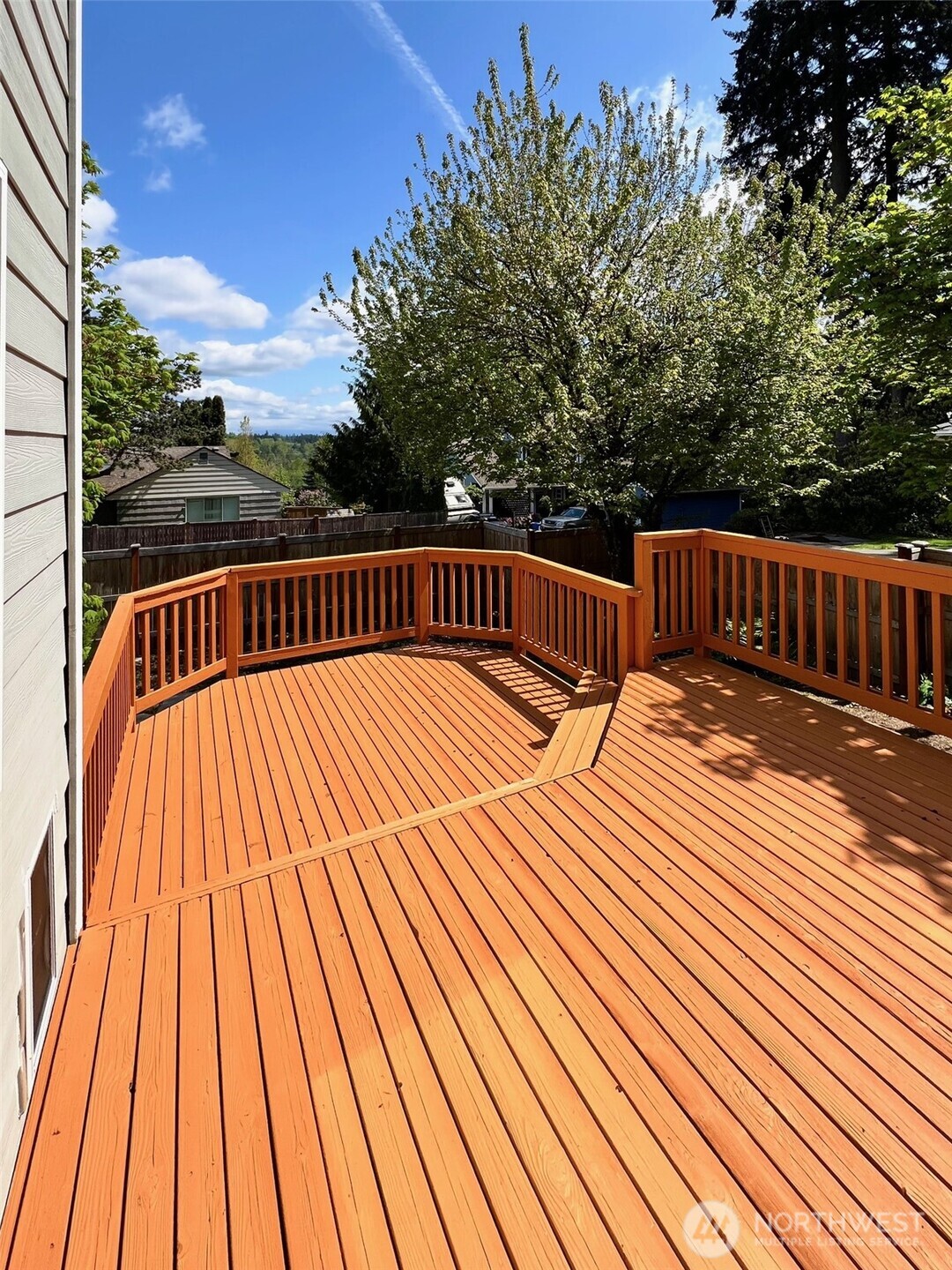 132 170th Place Southeast Bothell, WA 98012 - Photo 22 of 27 a view of balcony with wooden floor and fence