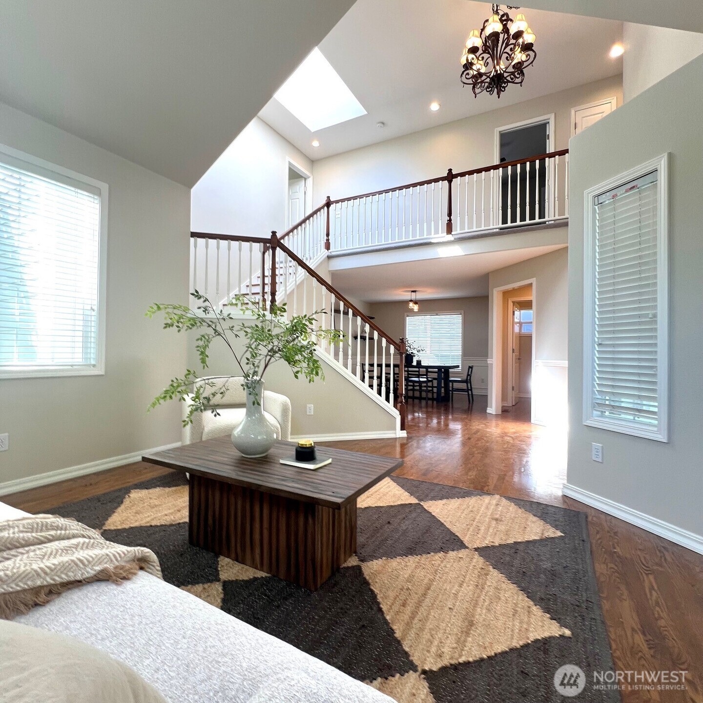 132 170th Place Southeast Bothell, WA 98012 - Photo 4 of 27 a bedroom with furniture window and wooden floor