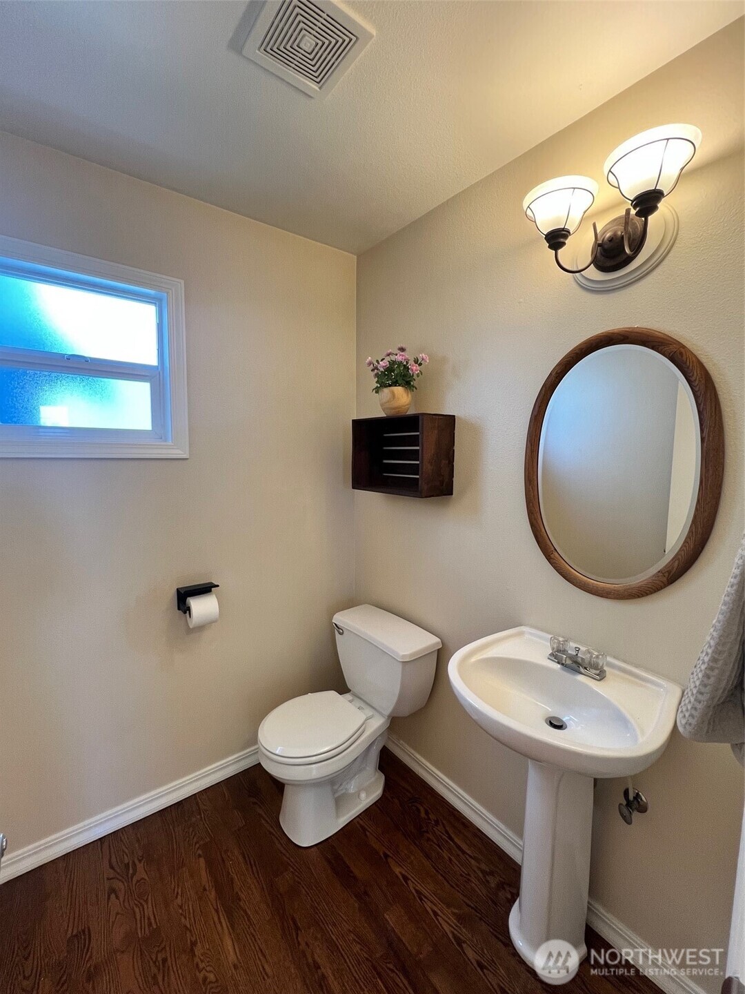132 170th Place Southeast Bothell, WA 98012 - Photo 6 of 27 a bathroom with a toilet a sink and a mirror