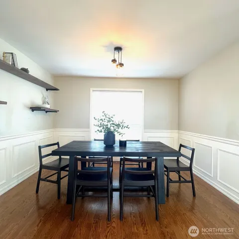 a view of a dining room with furniture and wooden floor
