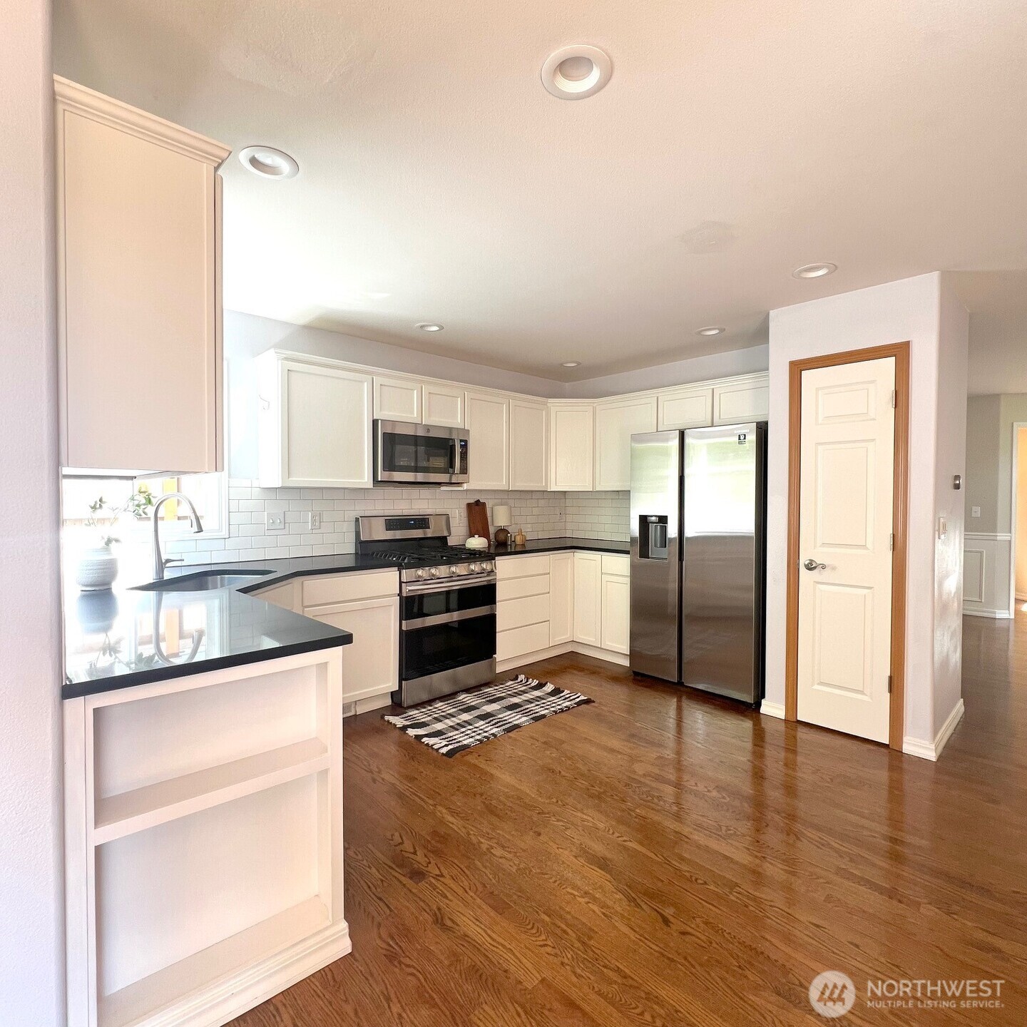 132 170th Place Southeast Bothell, WA 98012 - Photo 8 of 27 a kitchen with granite countertop stainless steel appliances and refrigerator