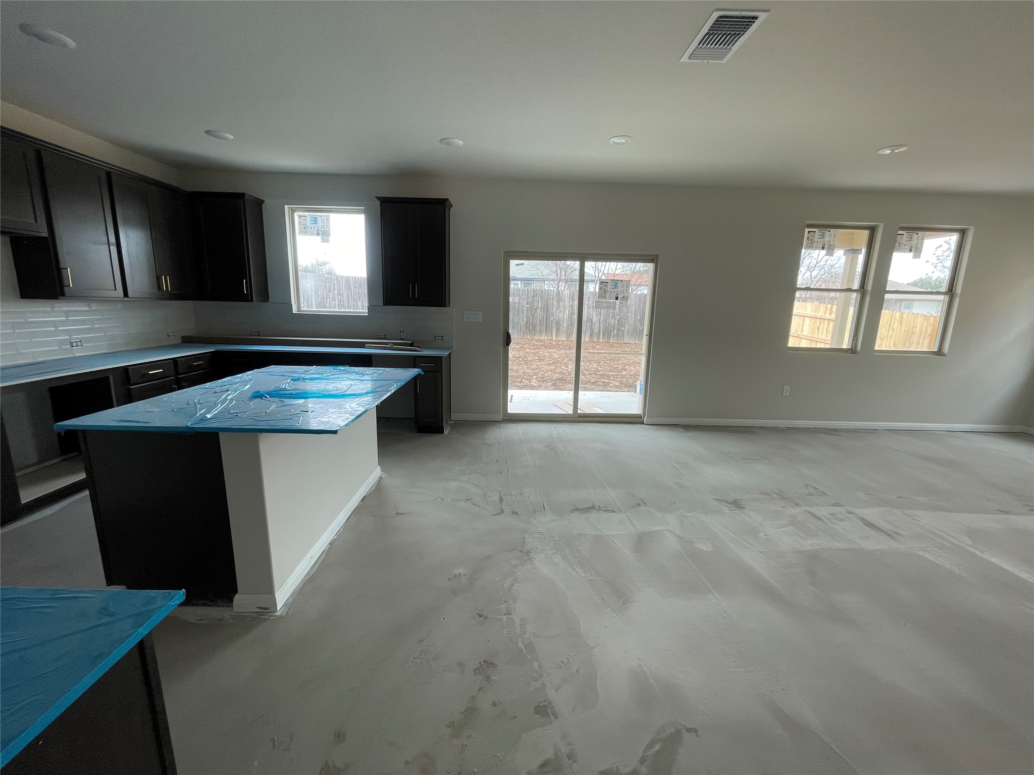 601 Palo Brea Loop Hutto, TX 78634 - Photo 14 of 39 a kitchen with stainless steel appliances granite countertop a stove a sink and a refrigerator