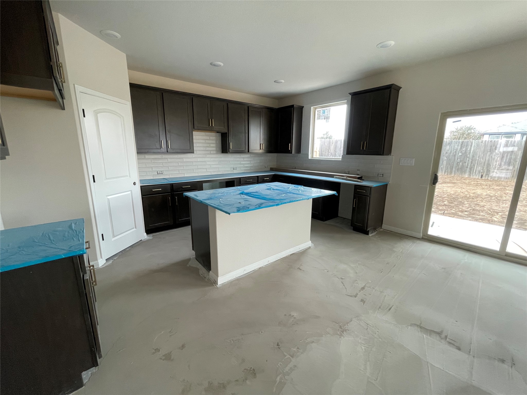 601 Palo Brea Loop Hutto, TX 78634 - Photo 16 of 39 a kitchen with stainless steel appliances granite countertop a stove a sink and a refrigerator