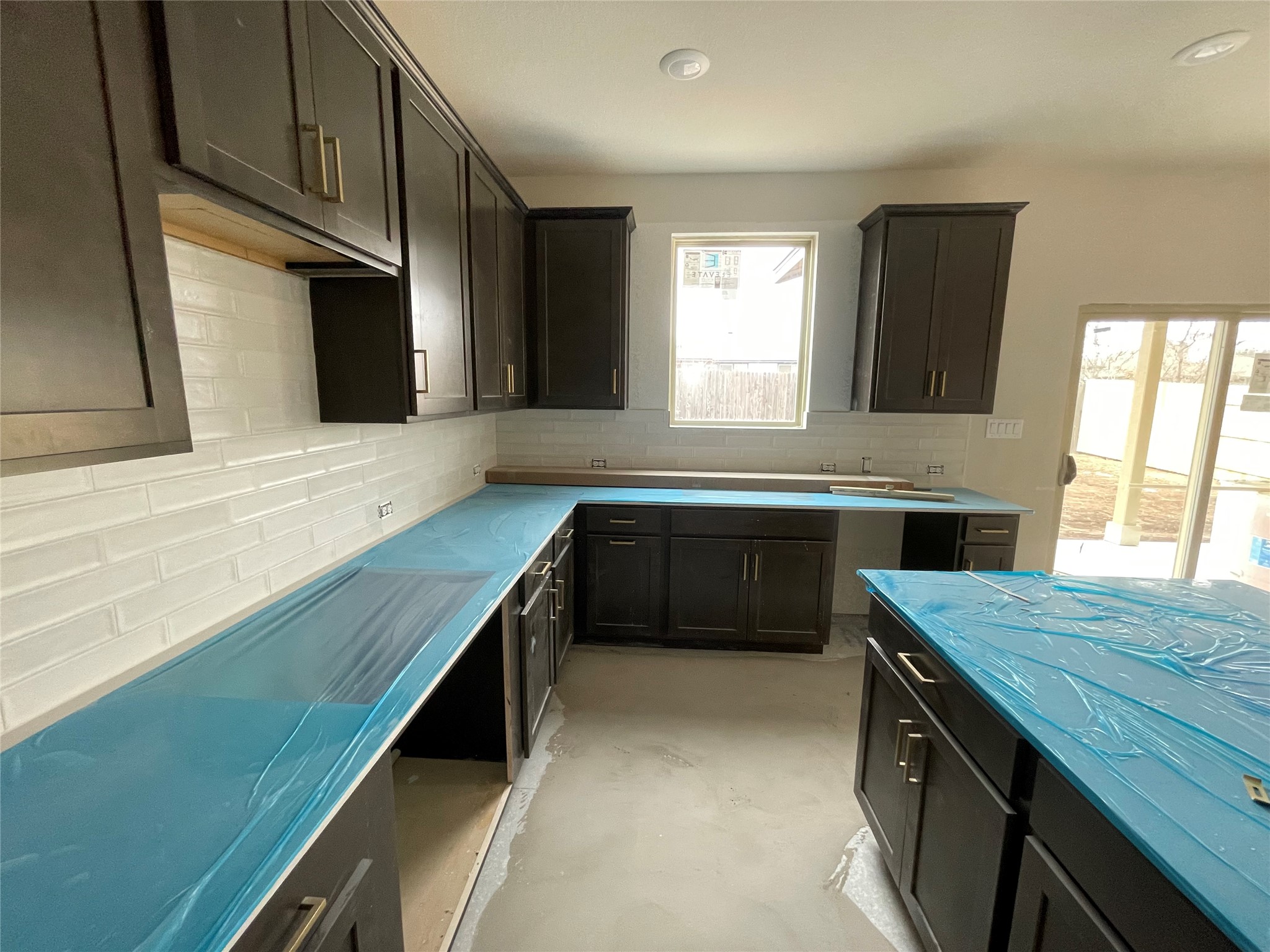 601 Palo Brea Loop Hutto, TX 78634 - Photo 17 of 39 a kitchen with a sink stove and cabinets