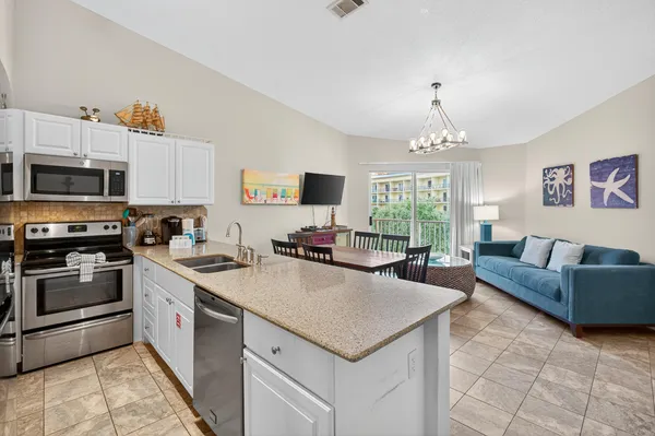 a view of kitchen with sink and microwave