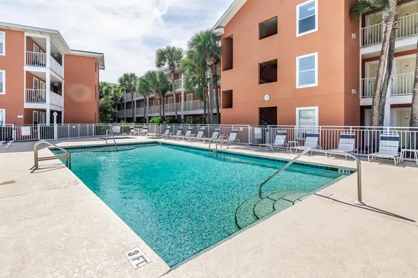 a view of a swimming pool with a lounge chairs