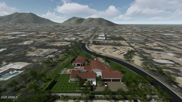 a view of a white house in front of a big yard with plants and large trees