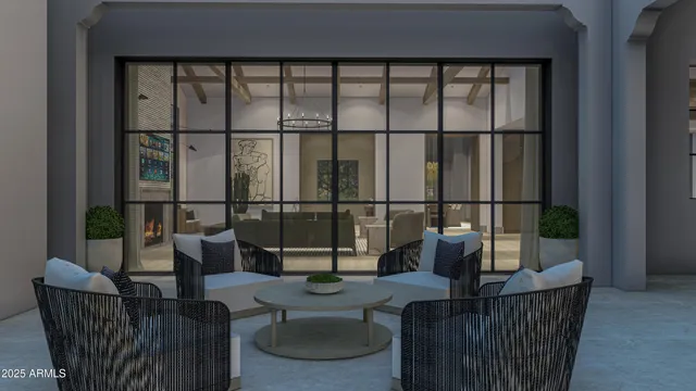 a living room with furniture and a chandelier