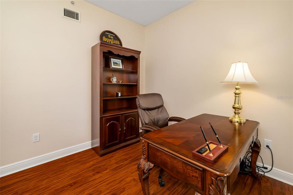 8407 Miramar Way Lakewood Ranch, FL 34202 - Photo 11 of 83 a view of a workspace with furniture and wooden floor