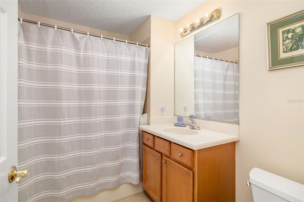 8407 Miramar Way Lakewood Ranch, FL 34202 - Photo 14 of 83 a bathroom with a sink a vanity and a mirror