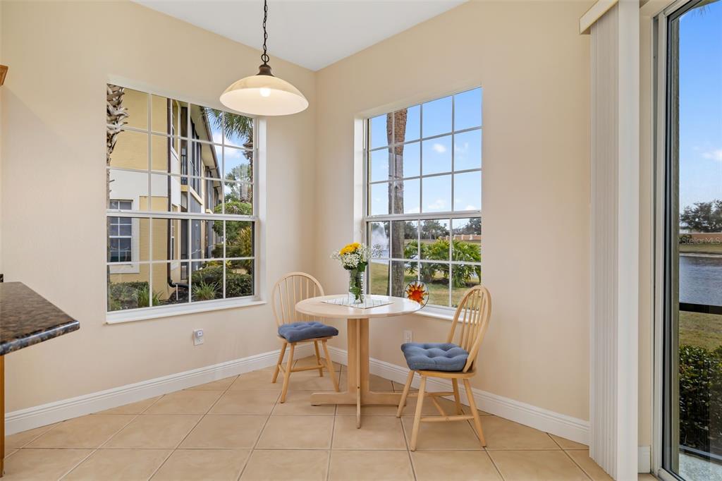8407 Miramar Way Lakewood Ranch, FL 34202 - Photo 22 of 83 a dining room with furniture and window