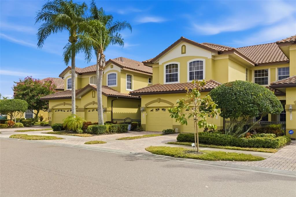 8407 Miramar Way Lakewood Ranch, FL 34202 - Photo 3 of 83 a front view of a house with a yard