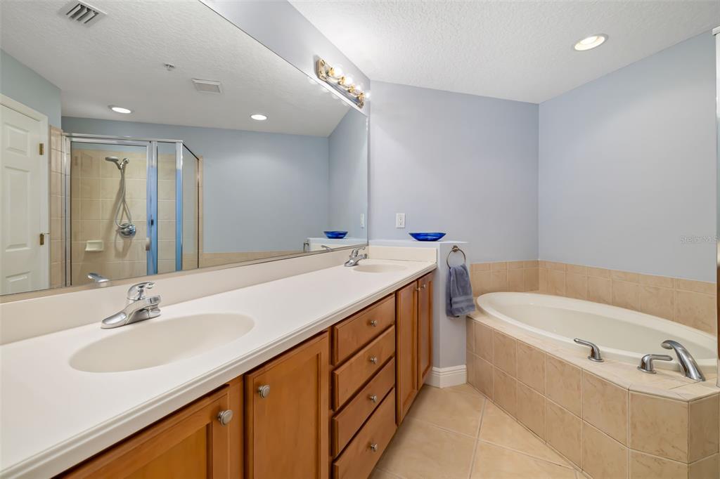 8407 Miramar Way Lakewood Ranch, FL 34202 - Photo 32 of 83 a bathroom with a double vanity sink mirror and bathtub