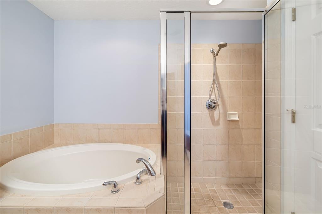 8407 Miramar Way Lakewood Ranch, FL 34202 - Photo 33 of 83 a bathroom with a tub and shower