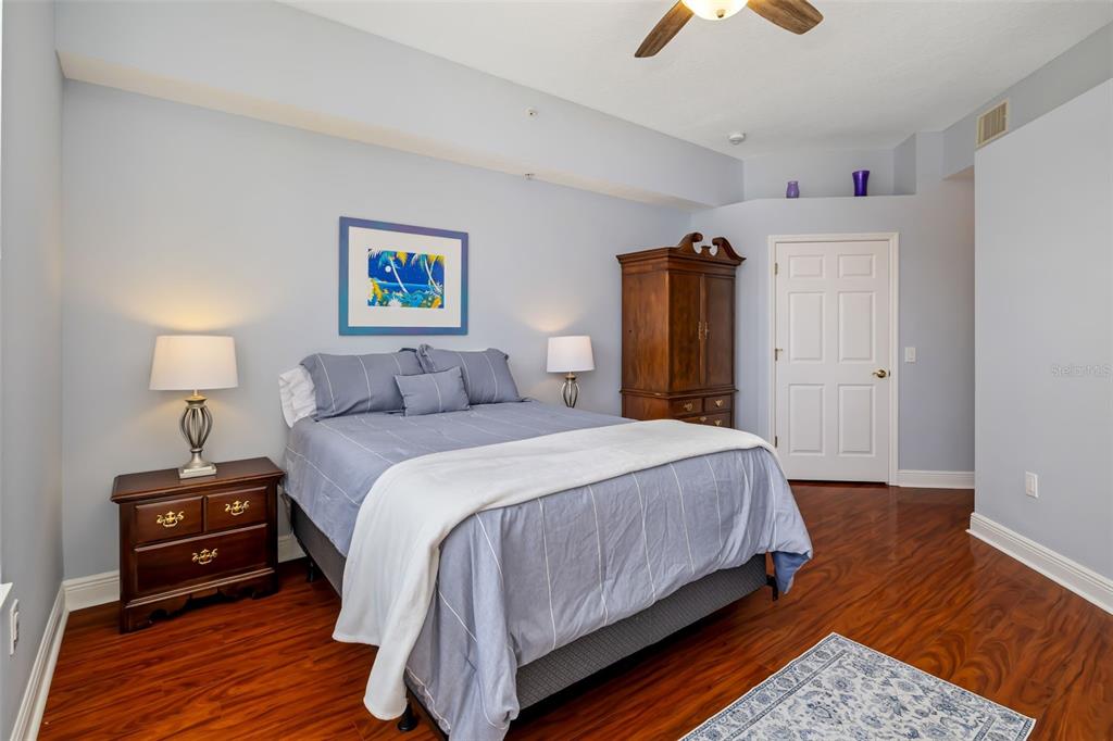 8407 Miramar Way Lakewood Ranch, FL 34202 - Photo 36 of 83 a bedroom with a bed and wooden floor