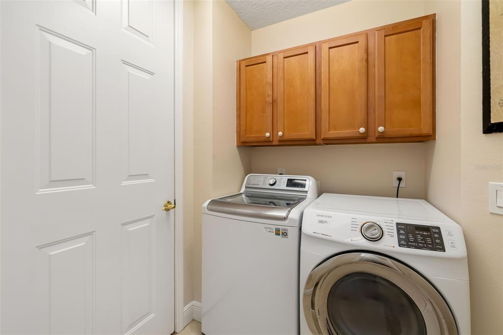 8407 Miramar Way Lakewood Ranch, FL 34202 - Photo 40 of 83 a view of storage and utility room with washer and dryer
