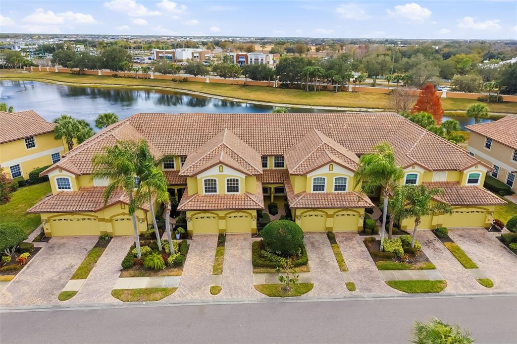 8407 Miramar Way Lakewood Ranch, FL 34202 - Photo 49 of 83 an aerial view of residential houses with outdoor space and lake view