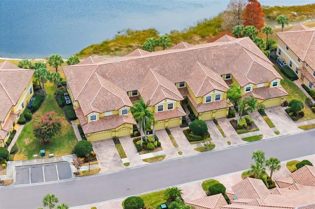 8407 Miramar Way Lakewood Ranch, FL 34202 - Photo 55 of 83 an aerial view of a house with a yard and garden