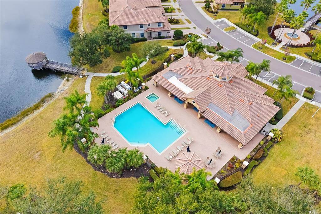 8407 Miramar Way Lakewood Ranch, FL 34202 - Photo 59 of 83 an aerial view of a house with a garden and swimming pool