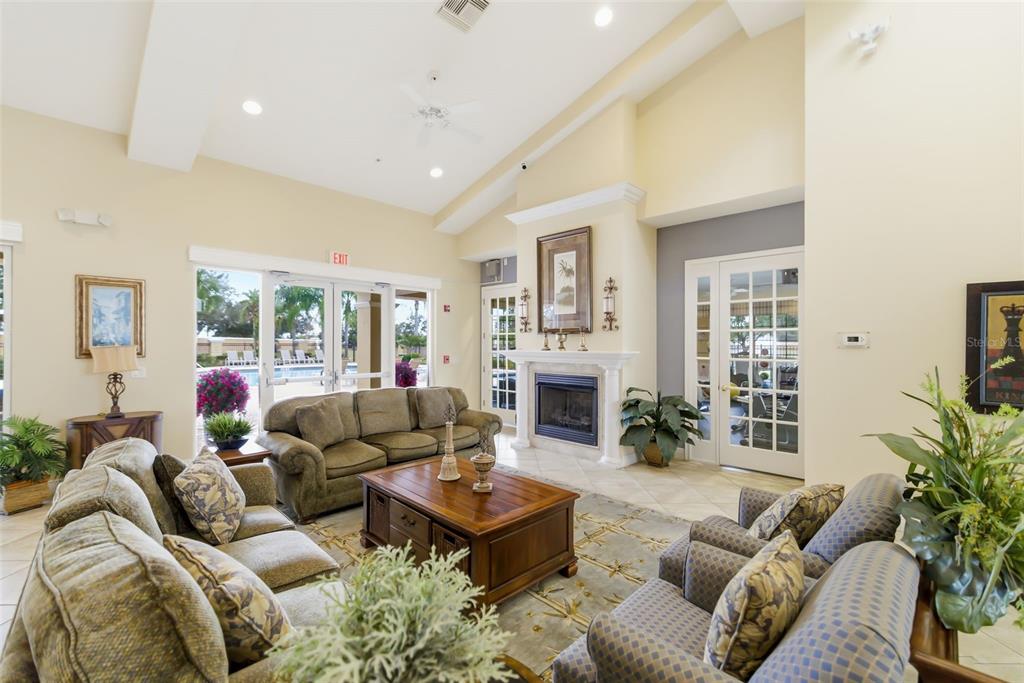 8407 Miramar Way Lakewood Ranch, FL 34202 - Photo 65 of 83 a living room with furniture fireplace and a potted plant