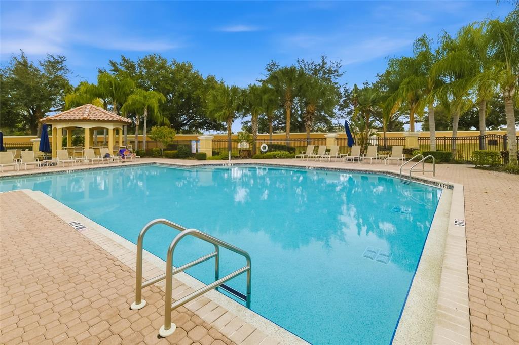 8407 Miramar Way Lakewood Ranch, FL 34202 - Photo 75 of 83 a view of a swimming pool with a lounge chairs