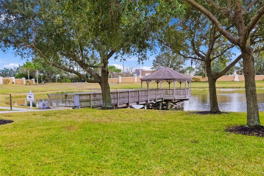 8407 Miramar Way Lakewood Ranch, FL 34202 - Photo 79 of 83 a view of a swimming pool with lawn chairs under an umbrella