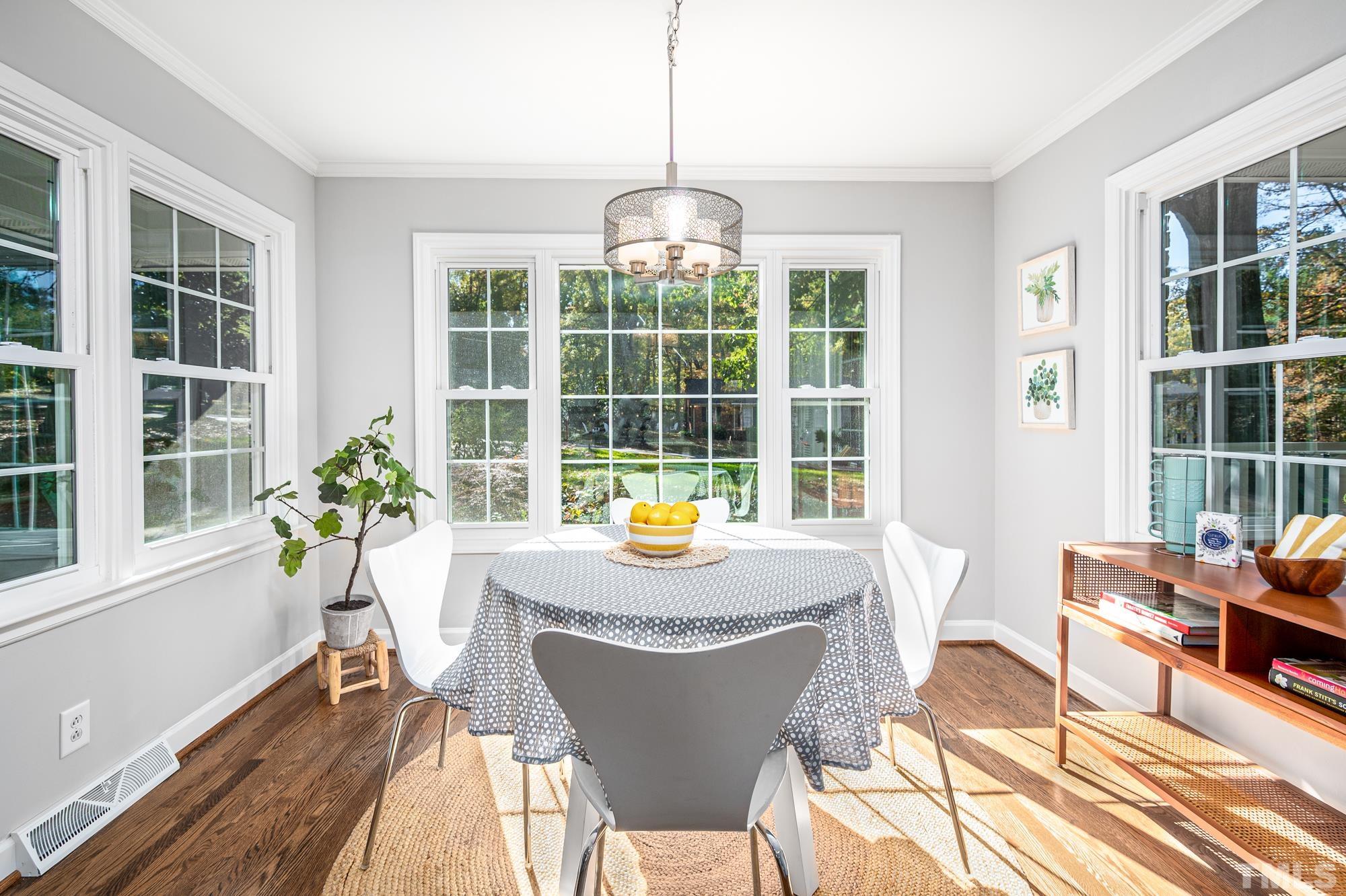 2910 Buckingham Road Durham, NC 27707 - Photo 15 of 30 a view of a dining room with furniture window and outside view